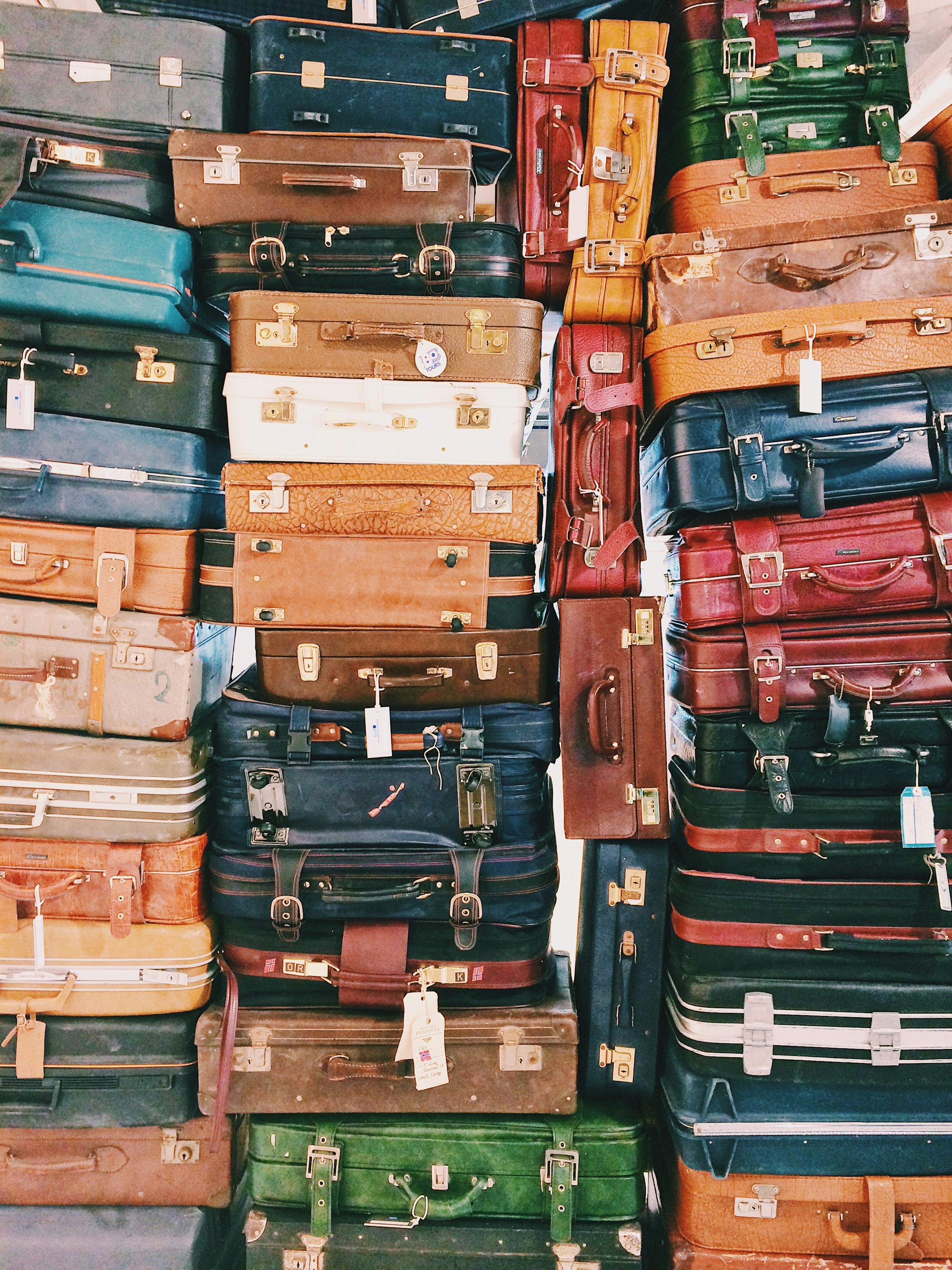 Traveler rolling a compact carry-on through a busy station